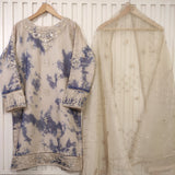 Traditional embroidered outfit with a blue and beige pattern on a white background