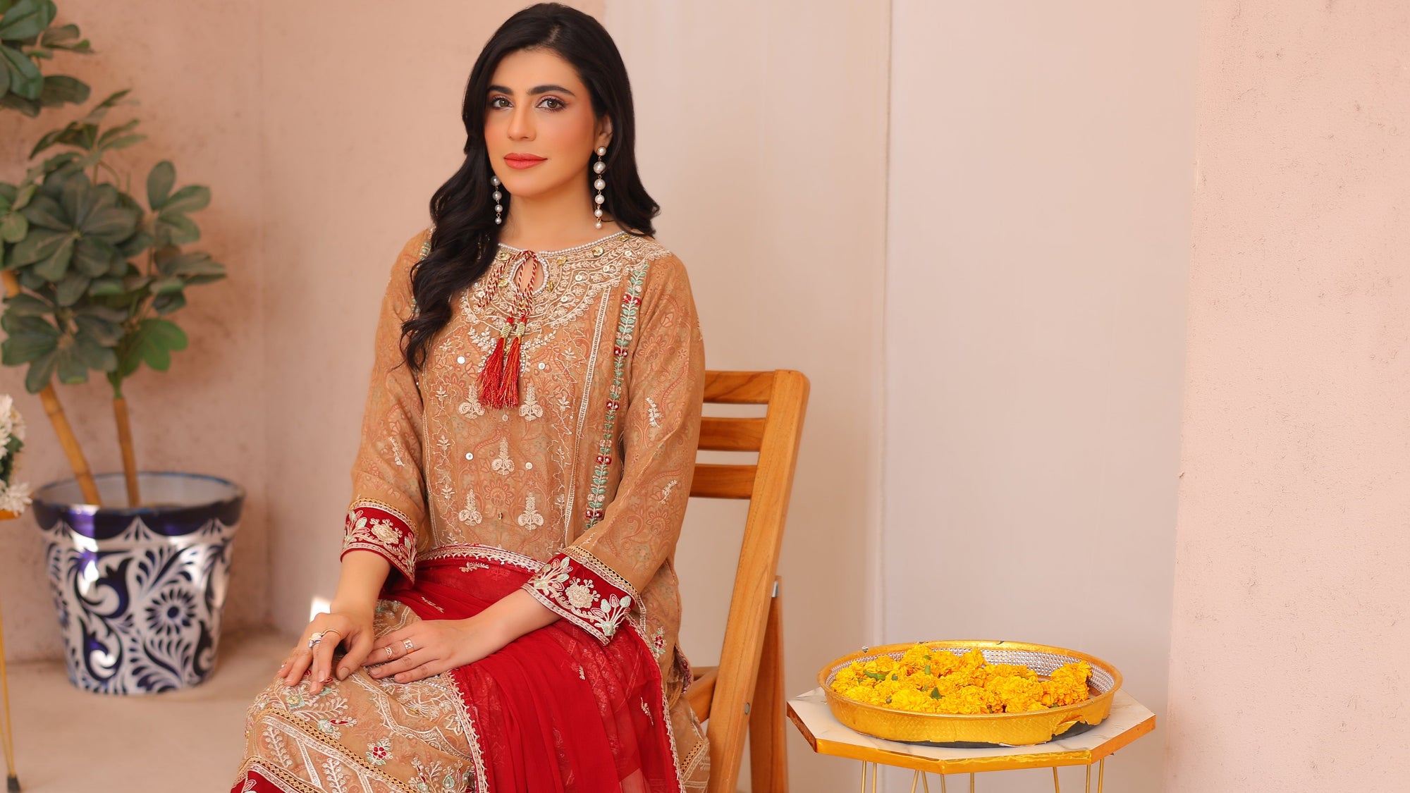 Woman in a Gharara with elegance style by fabric emporium the best online branded suit for women 